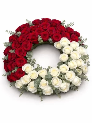 Coroană funerară trandafiri roșii și albi pe suport rotund din burete umed, cu livrare gratuită și rapidă în toate sectoarele din București.